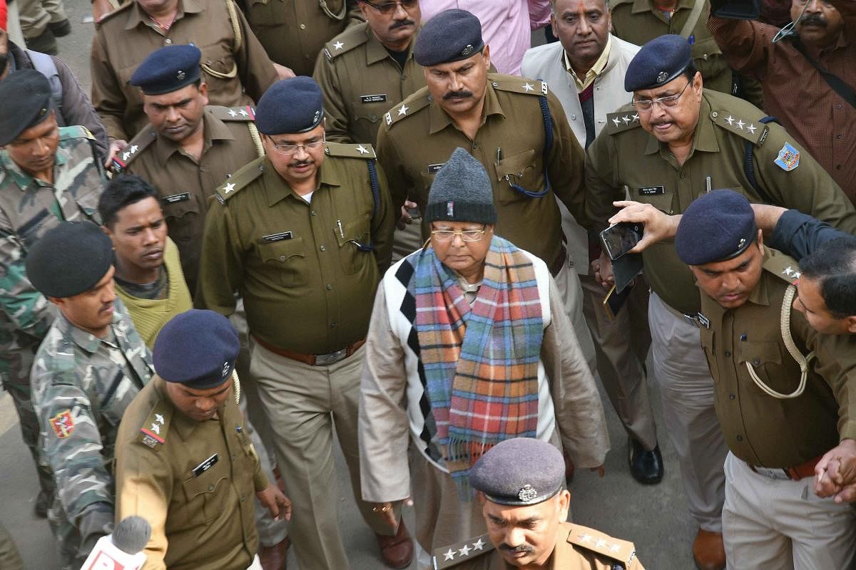 Bihar's former chief minister Lalu Yadav escorted by police officials to be produced at the special CBI court to receive his quantum sentence in fodder scam case, in Ranchi. PTI
