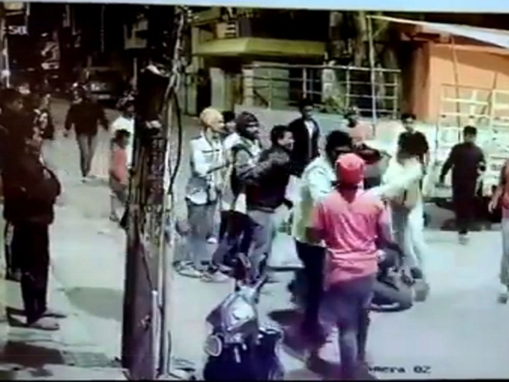 The assault was captured on two CCTV cameras where a gang of at least 12 drunk men was seen dancing on the road, partying and obstructing traffic. ANI video/Screen Grab