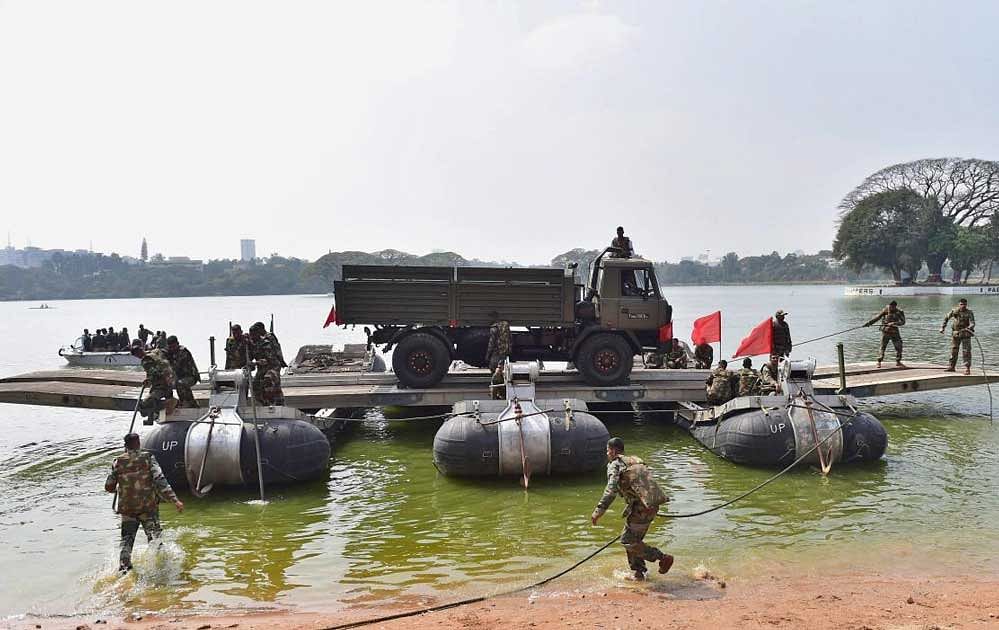 New recruits of Madras Engineer Group and Centre during a military training demonstration at MEG Centre in Bengaluru on Wednesday. PTI Photo