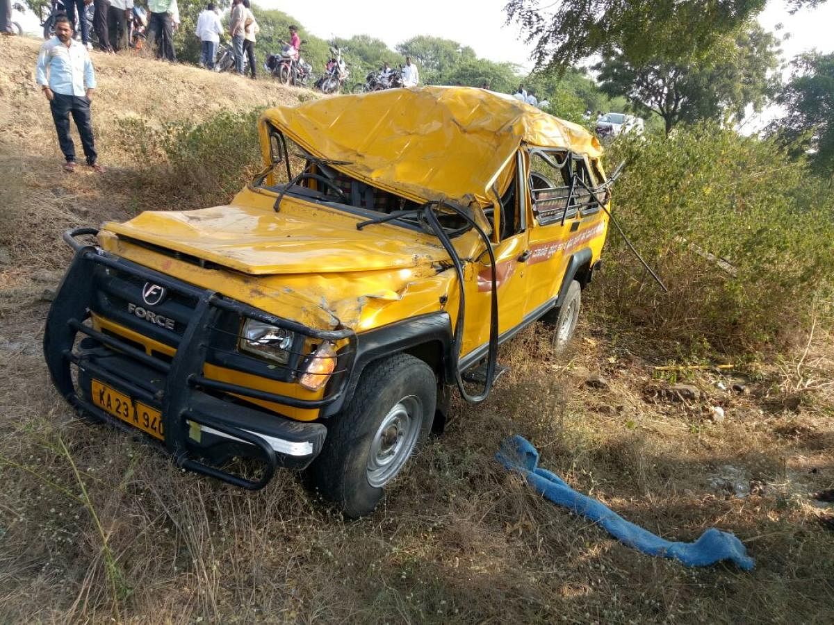 The school vehicle that collided head-on with a bike near Khotnatti Cross, Athani taluk in Belagavi district on Thursday. dh photo
