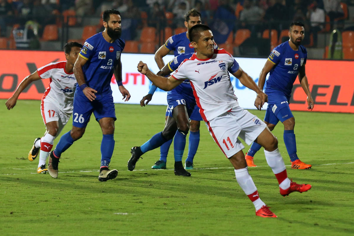 Sunil Chhetri of Bengaluru FC takes a penalty shot to score a goal during match 50 of the Hero Indian Super League between Mumbai City FC and Bengaluru FC held at the Mumbai Football Arena, Mumbai India on the 18th January 2018 Photo by: Faheem Hussain / ISL / SPORTZPICSLethal: Bengaluru FC's Sunil Chhetri celebrates after scoring against Mumbai City FC in an ISL encounter on Thursday. ISL Media