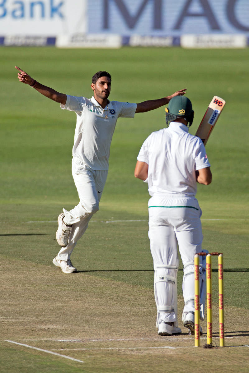 India's Bhuvneshwar Kumar (left) celebrates after taking the wicket of South Africa's Aiden Markram. REUTERS