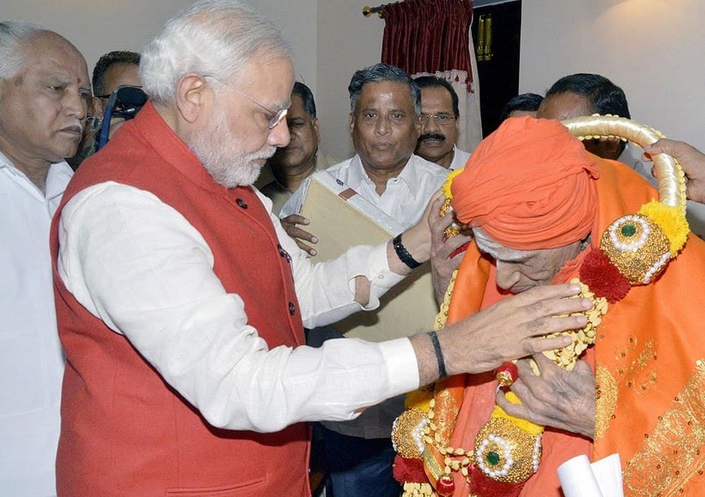 Shivakumara Swami with PM Modi. file photo