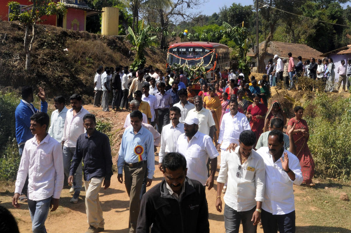 Villagers of Kadagaravalli celebrate the KSRTC bus service that has been introduced after 70 years of Independence, near Sakleshpur, Hassan district on Thursday.
