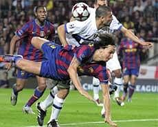 Barcelona's Zlatan Ibrahimovic duels for the ball against Inter Milan's Walter Samuel during the Champions League semifinal second leg soccer match on Wednesday. AP