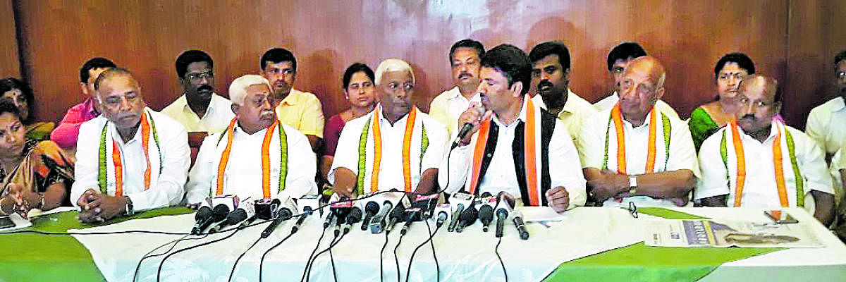 Congress leaders, belonging to the Vokkaliga community, from Chamundeshwari Assembly constituency, address a press conference in Mysuru on Tuesday.