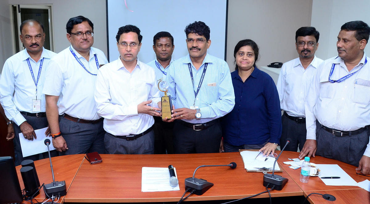 Mangaluru International Airport Director V V Rao and staff with the 'cleanest airport award' in Mangaluru airport on Tuesday.