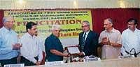 Private College Managements Association President Dr H Shantharam felicitating Mangalore University Vice-Chancellor Prof T C Shivashankara Murthy in Mangalore on Friday.