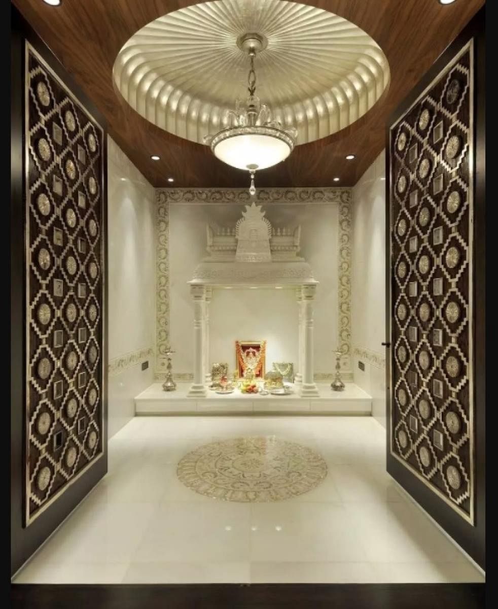 Beautiful chandeliers will instantaneously enhance the beauty quotient of the puja room.