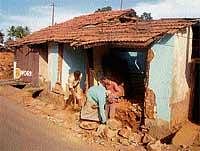 Houses being evicted for road widening in Suntikoppa.  DH Photo