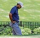 pensive US Tiger Woods reacts after missing the cut at the Quail Hollow golf championship on Friday. AP