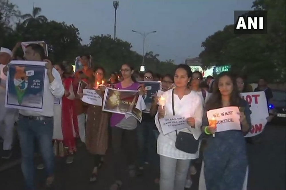 People hold a candlelight march against the rape and murder of the minor girl. ANI photo.