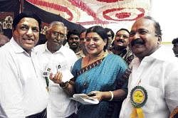 Outgoing president Jayamala congratulating the newly-elected president Basanth Kumar Patil after Karnataka Film Chamber of Commerce election in Bangalore on Saturday. DH photo