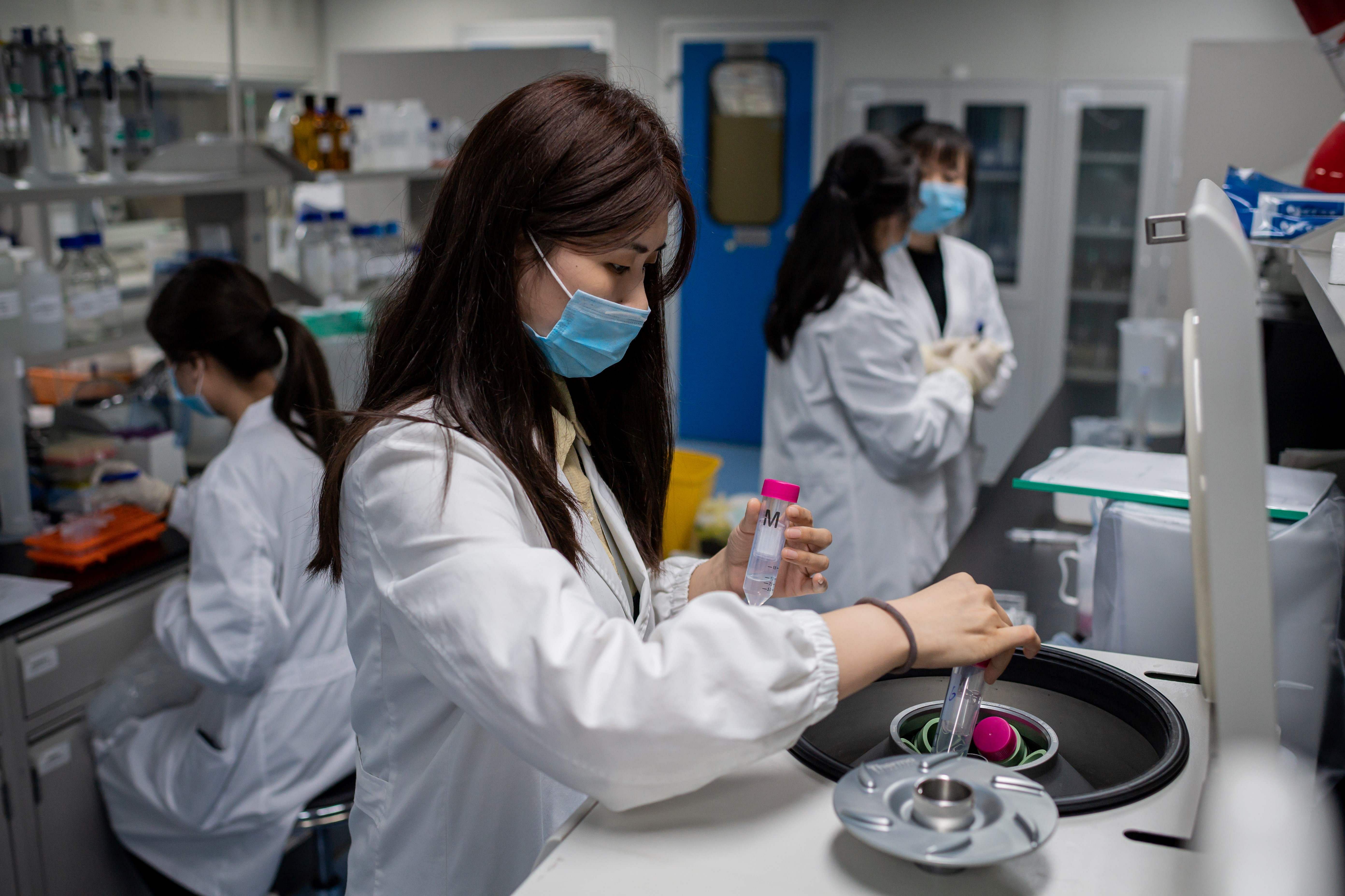 Engineers work on an experimental vaccine for the COVID-19 coronavirus at the Quality Control Laboratory at the Sinovac Biotech facilities in Beijing. - Sinovac Biotech, which is conducting one of the four clinical trials that have been authorised in China. (AFP Photo)