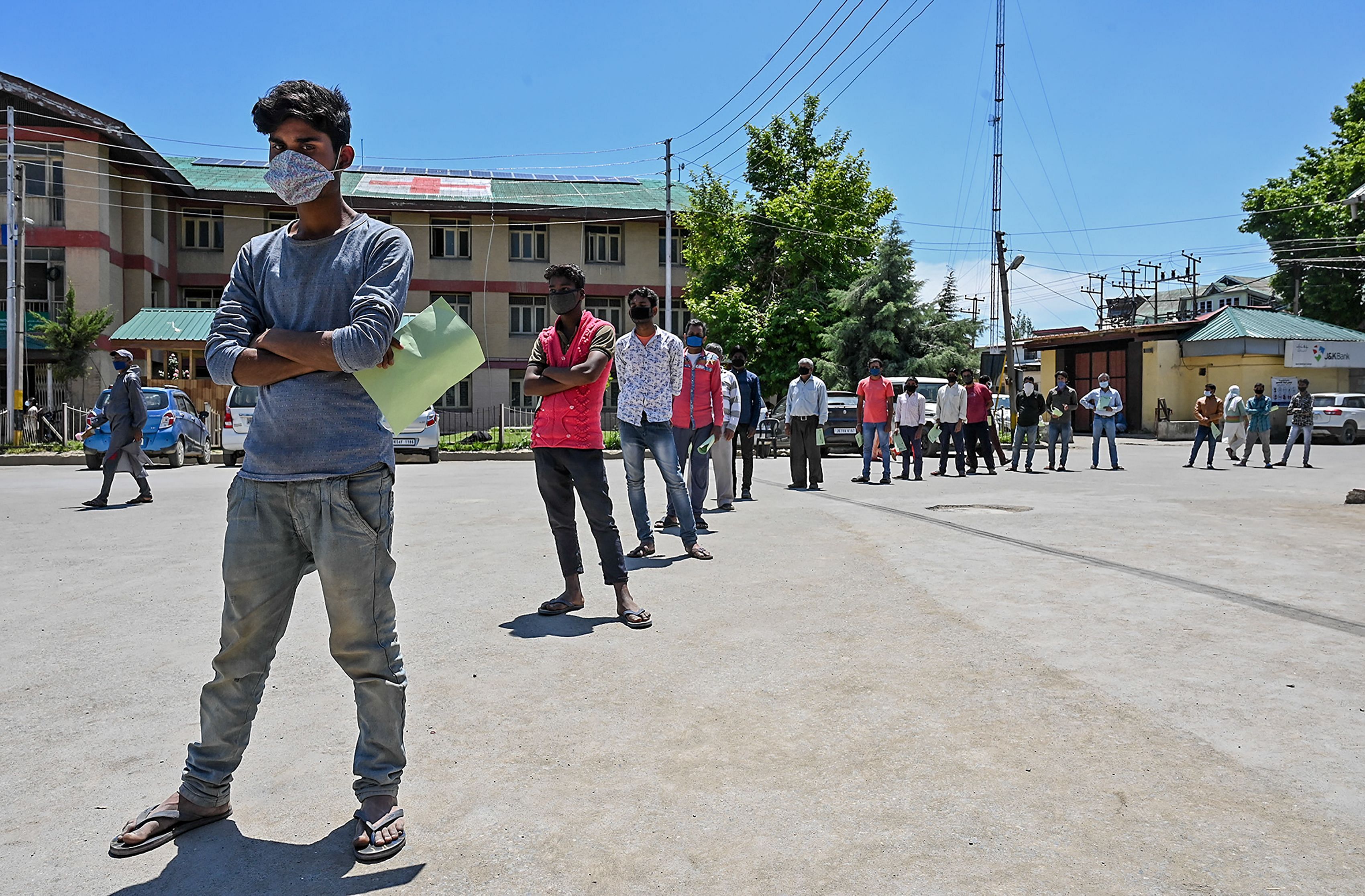 Migrant labourers queue to get a medical examination at a hospital during a government-imposed nationwide lockdown. (PTI Photo)