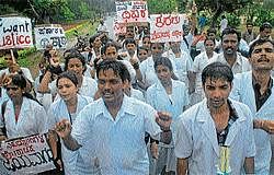 Retrenched para-medical staff of MMC & RI taking out a protest rally urging their reinstatement in Mysore on Monday. DH Photo