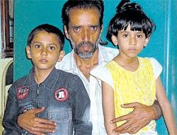 Fathima Saba and Syed Junaid with their father Syed Afsal.