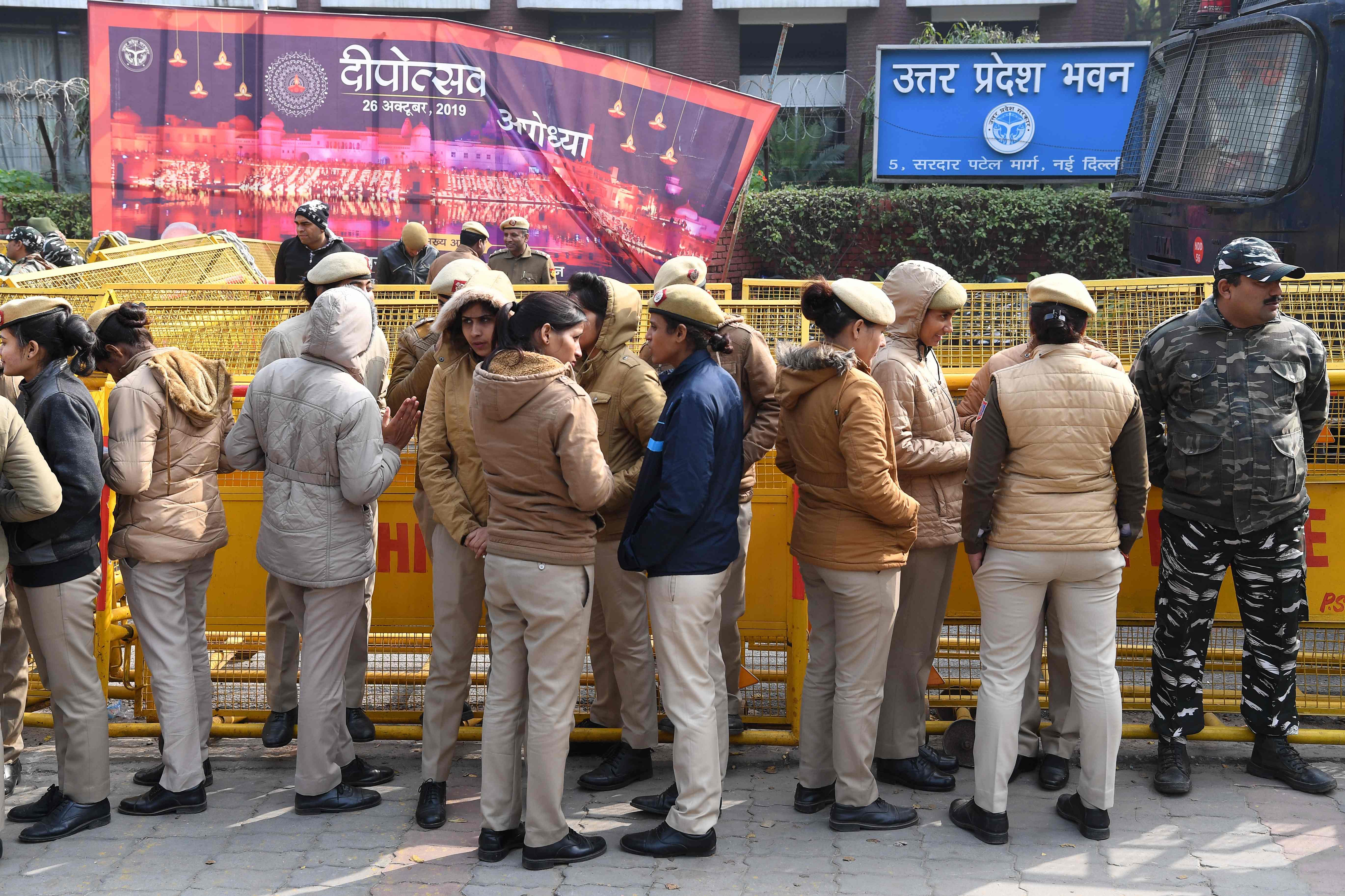 Delhi policewomen gather outside the Uttar Pradesh Bhawan (state house) before a demonstration against the crackdown on protesters in Uttar Pradesh state, over India's new citizenship law. (AFP Photo)