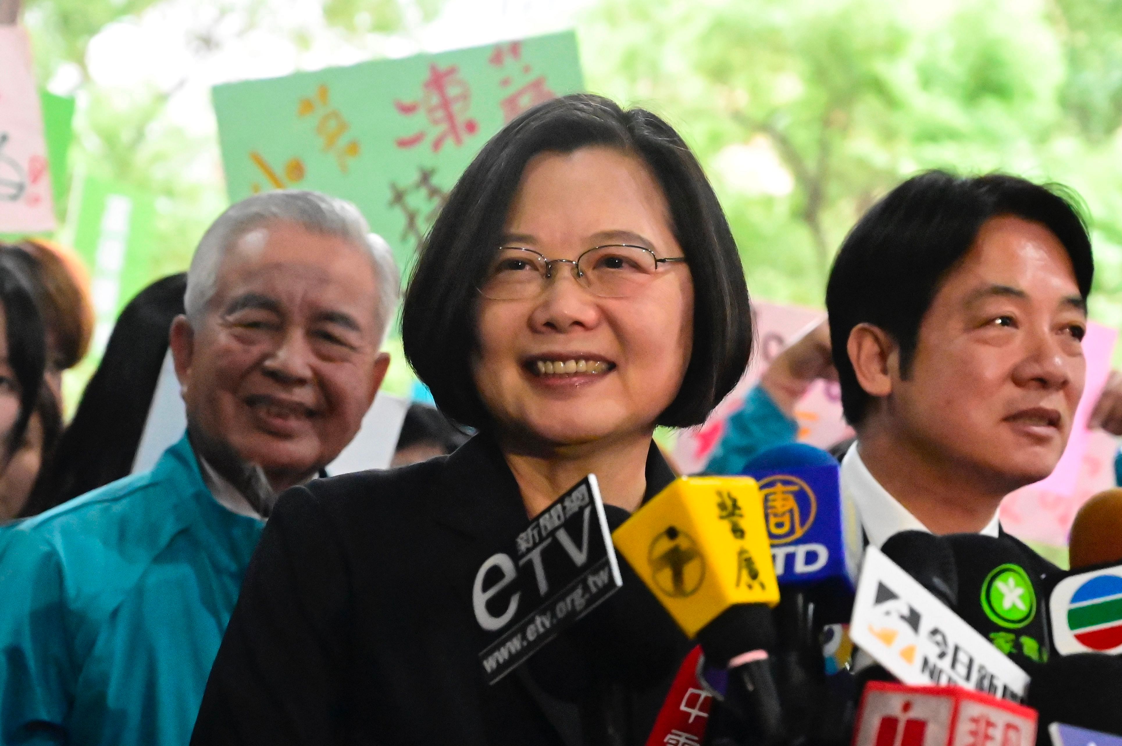 Taiwan's President Tsai Ing-wen (C) speaks after registering as a presidential candidate outside the Central Elections Committee in Taipei. (AFP Photo)