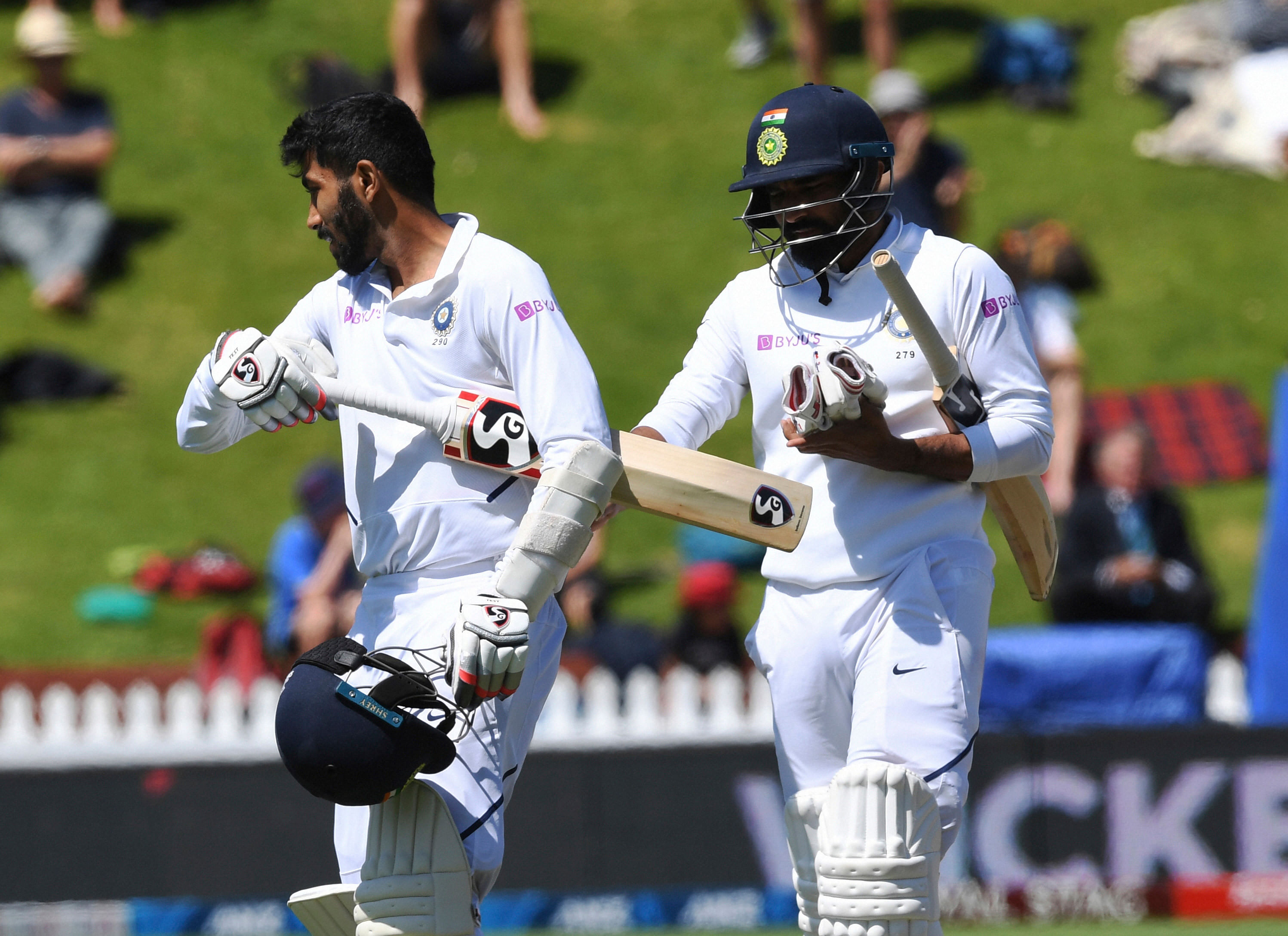 India's Jasprit Bumrah, left, and teammate Mohammed Shami walk from the field after India was dismissed for 191 runs in their second innings leaving New Zealand nine runs to win the first cricket test between India and New Zealand at the Basin Reserve in Wellington, New Zealand. (PTI Photo)