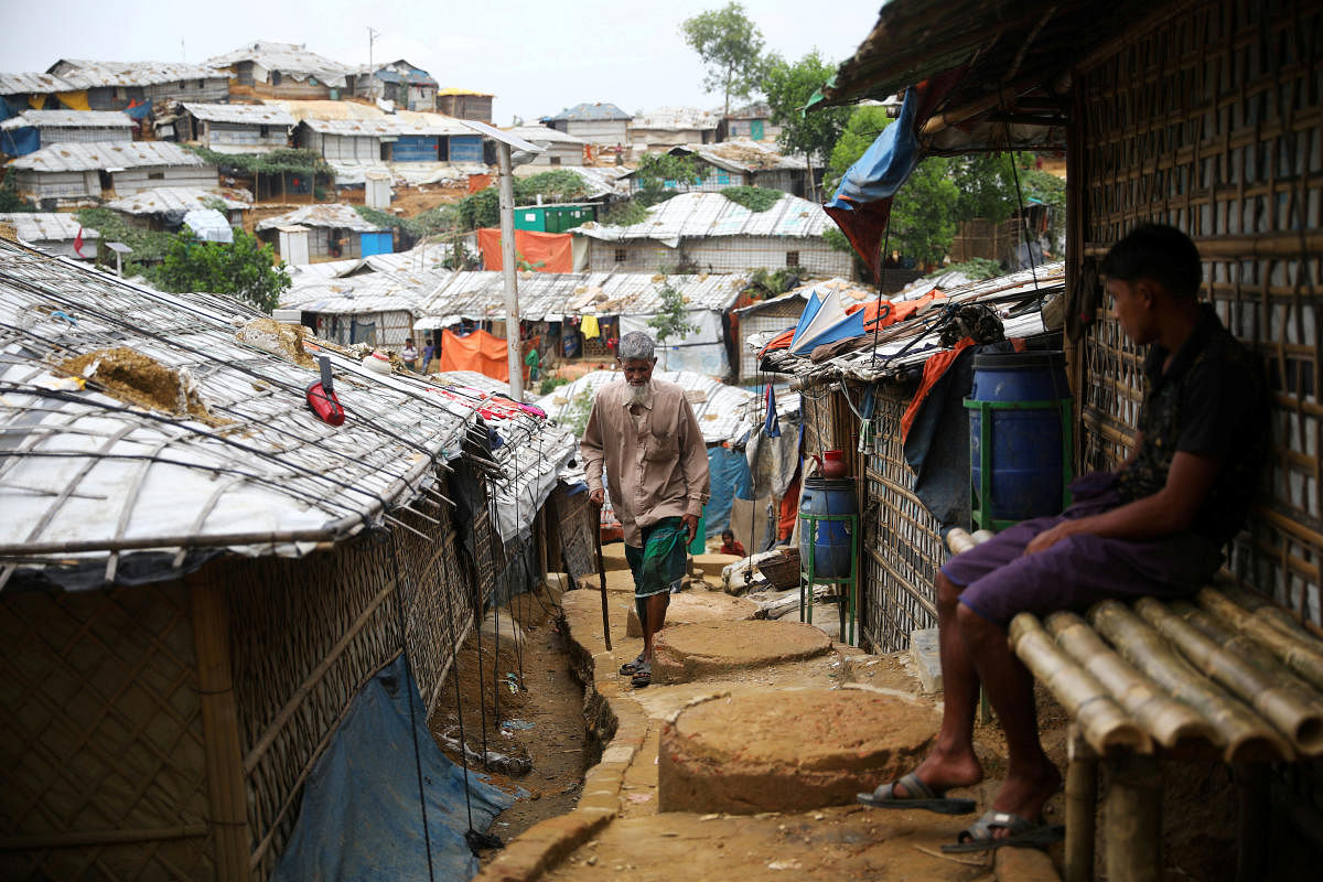 A Rohingya refugee walks at a refugee camp in Cox's Bazar (Reuters Photo)