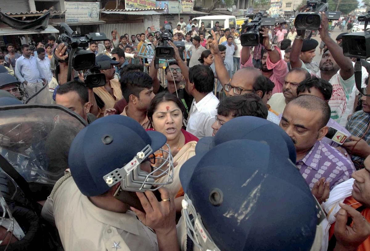BJP MP Locket Chatterjee in an arguement with the police personnel who stopped BJP workers to take the bodies of two party workers to Kolkata, at Minakhan in North 24 Parganas district of West Bengal, Saturday, June 9, 2019. The BJP workers were allegedly killed in a clash with the TMC workers, (PTI Photo for representation)