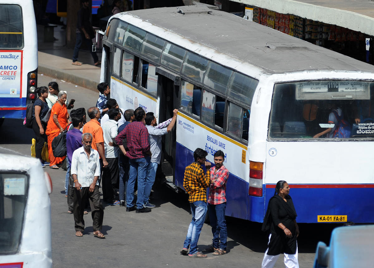People seen boarding buses at BMTC bus terminal (DH Photo | Pushkar V)