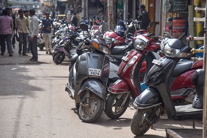 Two wheelers parked two lines at Godown road in Bengaluru. (DH Photo)