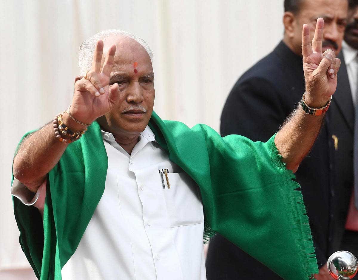 The green shawl was back on his shoulder while Governor Vajubhai R Vala administered the oath of office amid chants of 'Bharat Mata Ki Jai', 'BSY' and 'Modi' at the glass house inside Raj Bhavan.