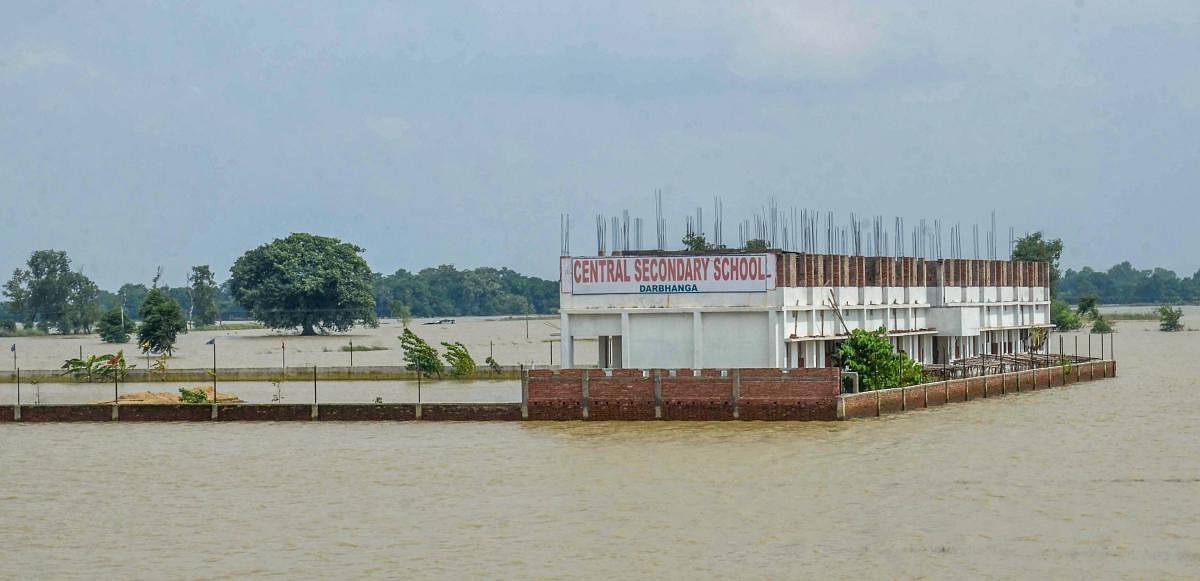 A view of a school partially submerged following incessant monsoon rainfall, at Darbhanga district, Tuesday. PTI file photo