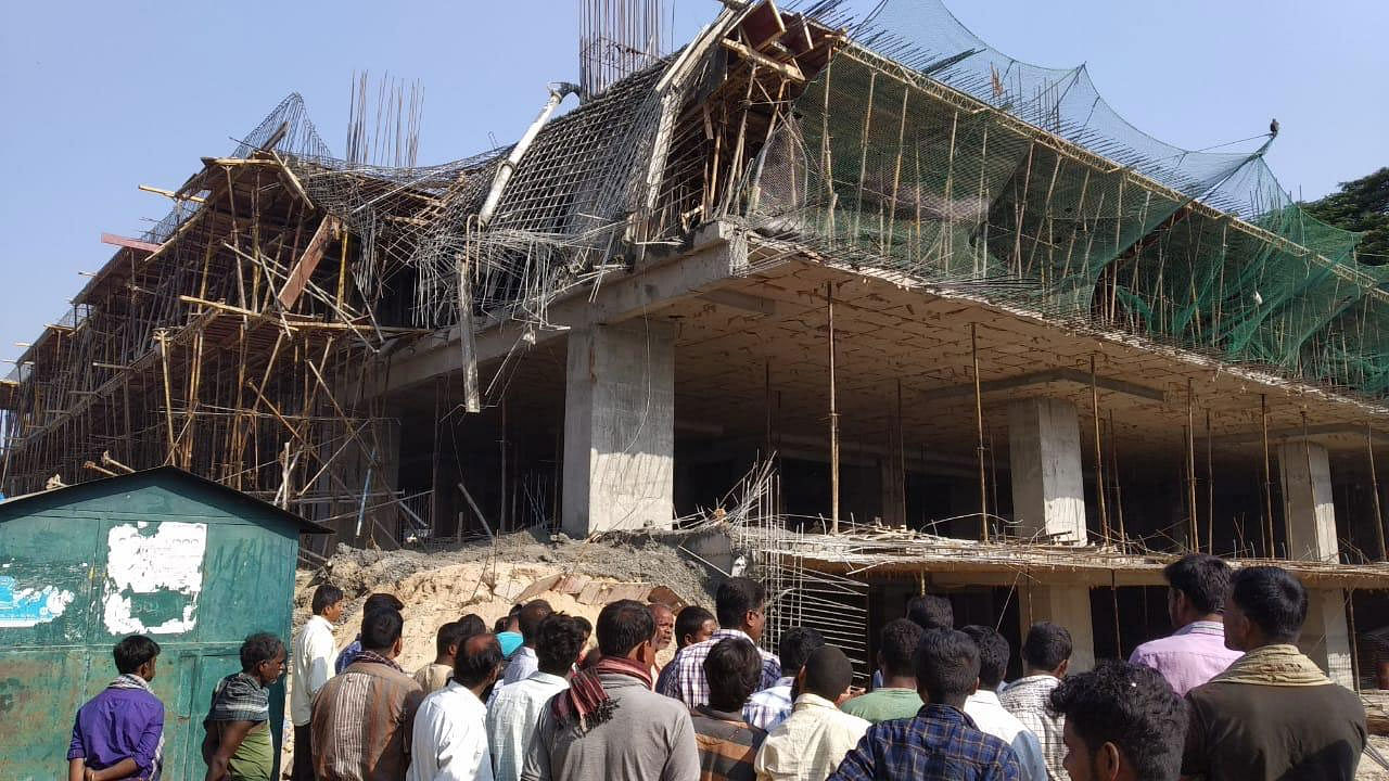 Two labourers were killed and eight of them suffered injuries after the third floor of an under-construction multi-level car parking building in APMC premise in RMC Yard in North Bengaluru, collapsed in the wee hours on Friday. DH photo