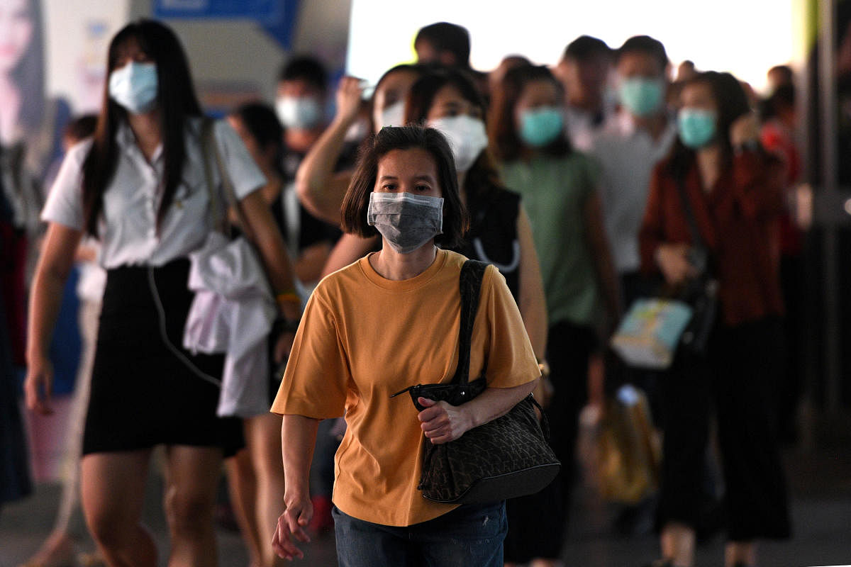 People wear protective masks to prevent from Coronavirus (Reuters Photo)