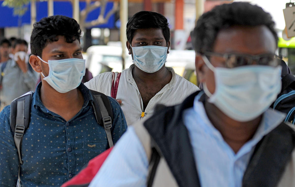 People seen wearing mask in wake of COVID-19 outbreak (DH Photo)