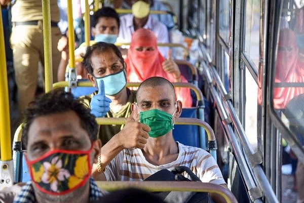 Migrants board NMMT buses at Turbhe MIDC Police Station to reach their native state Madhya Pradesh, during a nationwide lockdown in the wake of coronavirus pandemic, in Navi Mumbai, Sunday, May 10, 2020. (PTI Photo)