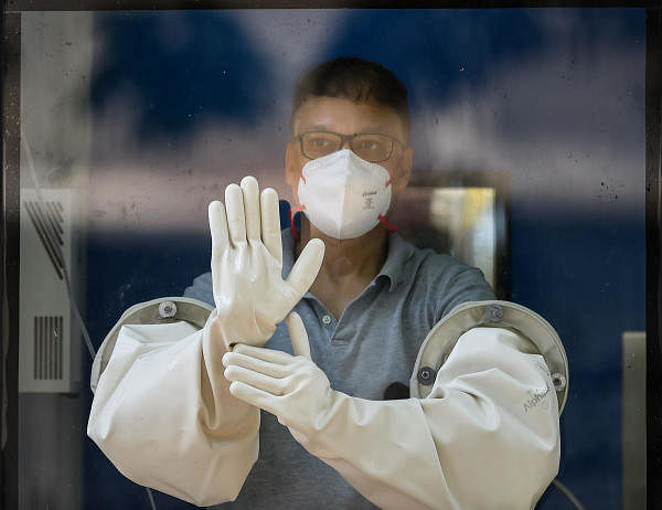  A medic is seen inside a new swab testing cabin at Podar hospital in Worli during a nationwide lockdown in the wake of coronavirus pandemic, in Mumbai. (Credit: PTI Photo)