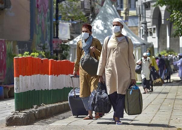 People who came for ‘Jamat’, a religious gathering at Nizamuddin Mosque, being taken to LNJP hospital for COVID-19 test, after several people showed symptoms of coronavirus, during a nationwide lockdown, in New Delhi, Tuesday, March 31, 2020. (PTI Photo/Vijay Verma)
