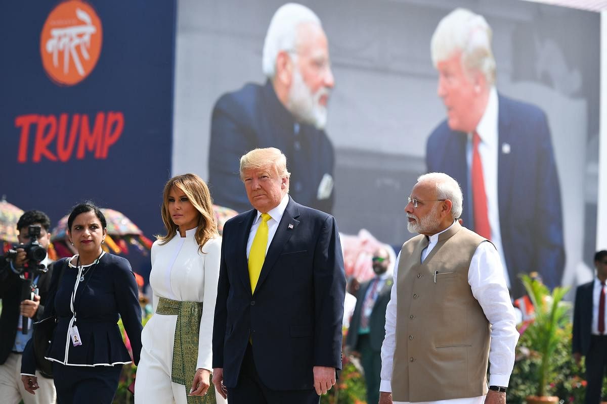 Prime Minister Narendra Modi (R) greet US President Donald Trump (C) and First Lady Melania Trump (2L) upon their arrival at Sardar Vallabhbhai Patel International Airport in Ahmedabad on February 24, 2020. (Photo by Mandel NGAN / AFP)