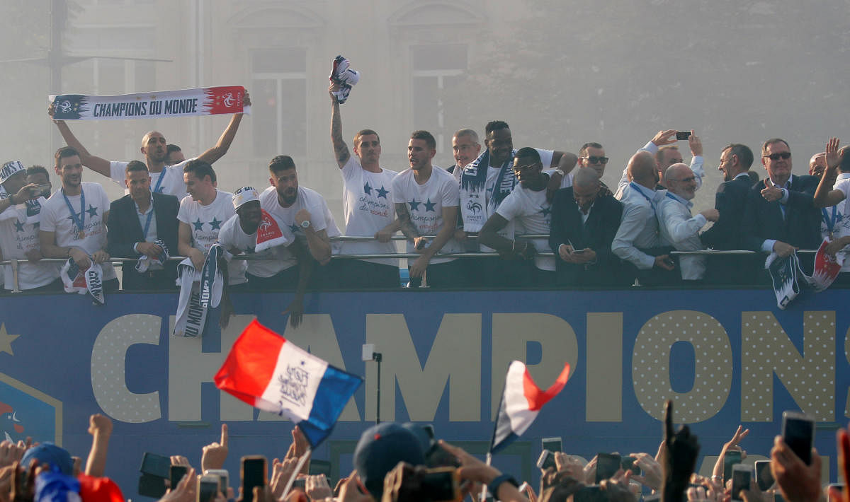 France's Antoine Griezmann and team mates during the parade. (REUTERS/Charles Platiau)