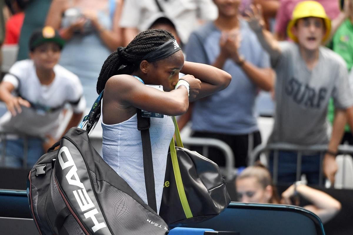 Coco Gauff of the US walks off the court after losing against Sofia Kenin of the US during their women's singles match on day seven of the Australian Open tennis tournament in Melbourne on January 26, 2020. Credit: AFP Photo