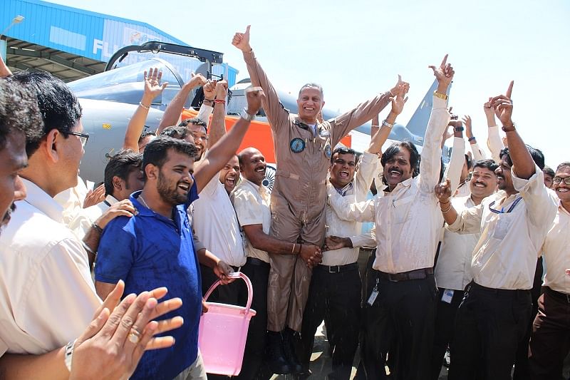 Air Cmde Muthana got a ‘dousing’ reception as he got out of the Tejas LCA after the flight that landed it the Final Operational Clearance. (DH Photo)