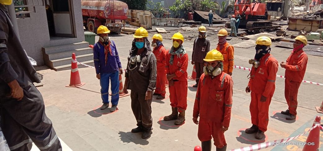 Workers resuming work while maintaining social distancing at Alang Ship Yard. (DH Photo)