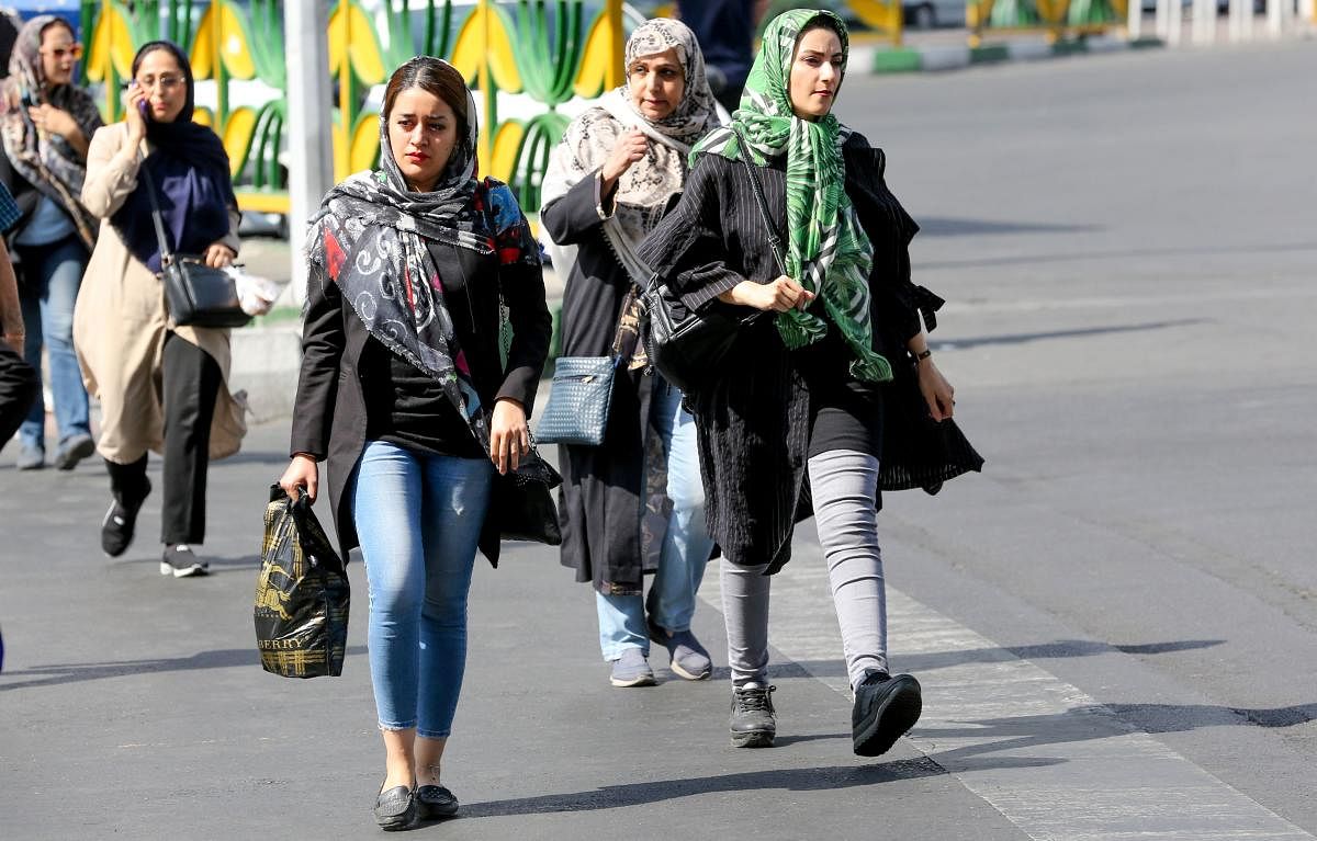 Iranian women walk in Sadeqyeh Square in the capital Tehran on October 8, 2019. After a ban spanning decades, Iranian women are set to freely enter a football stadium for the first time on October 10 as Iran hosts Cambodia in a World Cup 2022 qualifier at Tehran's Azadi stadium. Photo/AFP