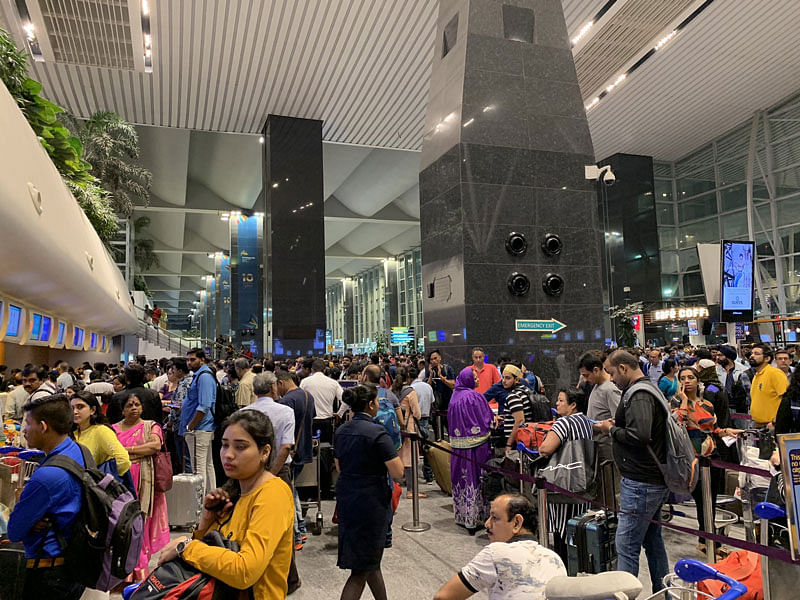 Stranded passengers in front of the IndiGo counter inside the Kempegowda International Airport (KIA), Benglauru on Monday.