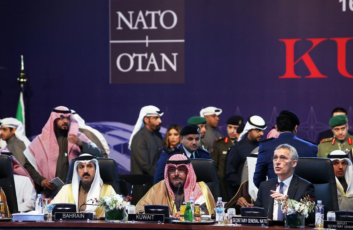 Chairman of Kuwait's national security apparatus (NSA) Sheikh Thamer al-Sabah (C) and NATO Secretary General Jens Stoltenberg (R) attend the NAC-ICI meeting to celebrate the 15th anniversary of the Istanbul cooperation initiative in Kuwait City. AFP