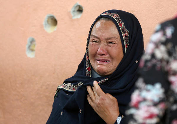 An Afghan woman cries while looking for her relative at a hospital which came under attack yesterday in Kabul, Afghanistan May 13, 2020. (Credit: Reuters Photo/Omar Sobhani)
