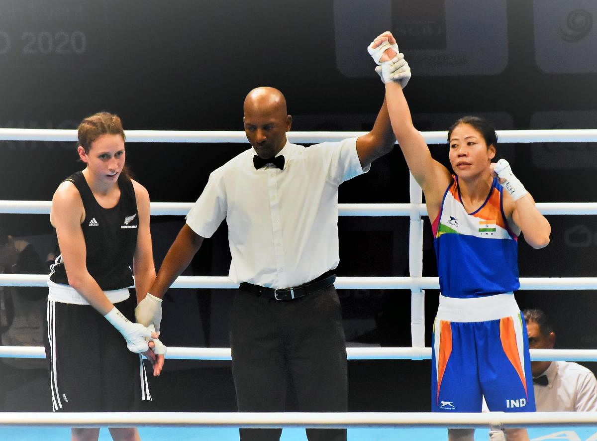  Referee raises the hand of boxer Mary Kom after winning her pre-quarter final bout in the ongoing Asia/Oceania Olympic Qualifiers in Amman (PTI Photo)