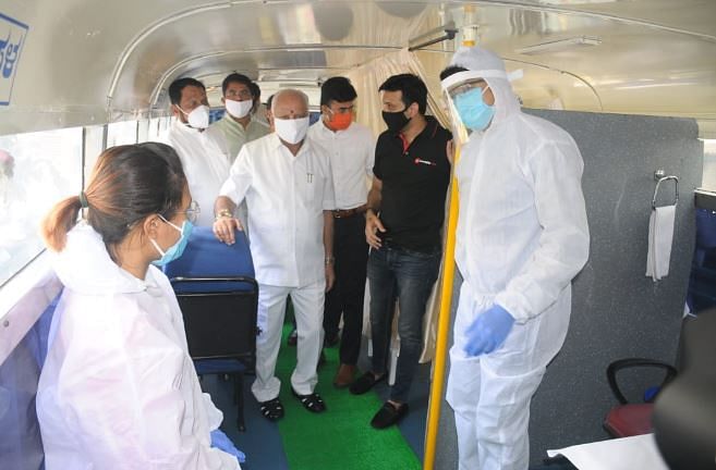 Chief Minister B S Yediyurappa inspects a mobile fever clinic built by KSRTC on Monday, May 11 (DH Photo/ Chiranjeevi Kulkarni)