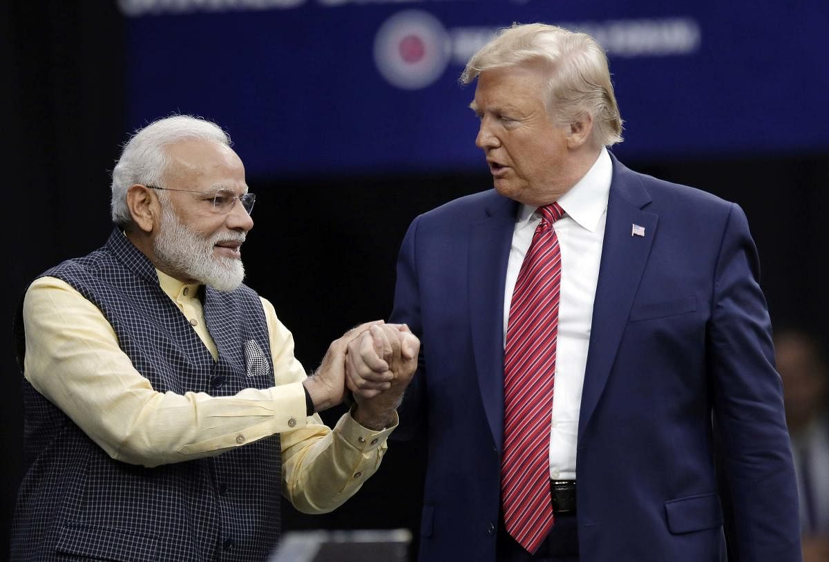 Prime Minister Narendra Modi and President Donald Trump shake hands after introductions during the "Howdi Modi" event Sunday, Sept. 22, 2019, at NRG Stadium in Houston. AP/PTI Photo