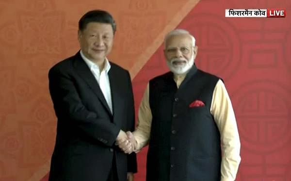 Prime Minister Narendra Modi with Chinese President Xi Jinping, in Mamallapuram. (Video grab/PTI photo)
