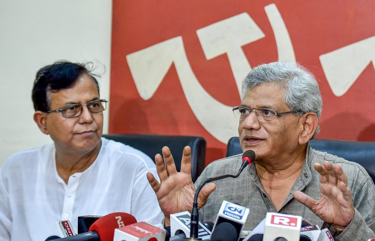 CPI(M) General Secretary Sitaram Yechury interacts with the media as party leader Mohammed Salim (PTI Photo)